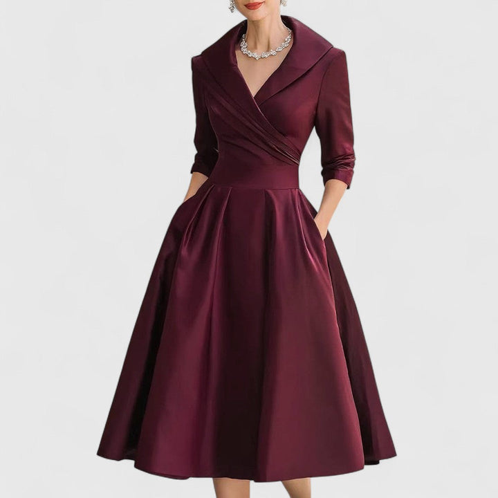 Chic women's V-neck midi dress featuring elegant 3/4 sleeves and a flattering fit, suitable for any occasion.
