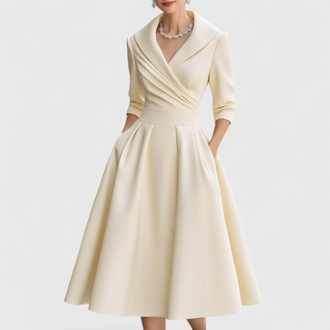 Stylish women's V-neck midi dress with elegant 3/4 sleeves, showcasing its flattering flared skirt design.