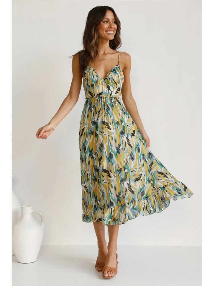 Flowy women's elegant midi dress, a versatile sundress for vacation. V-neck & spaghetti straps for a chic look.