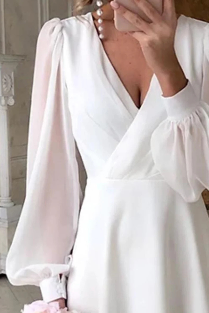 Stylish V-neck midi dress for women featuring chic puff sleeves, ideal for wedding guest attire.