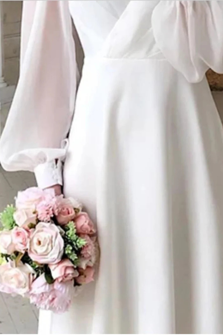 Beautiful women's formal midi dress with V-neck and puff sleeves, suitable for evening wear and events.