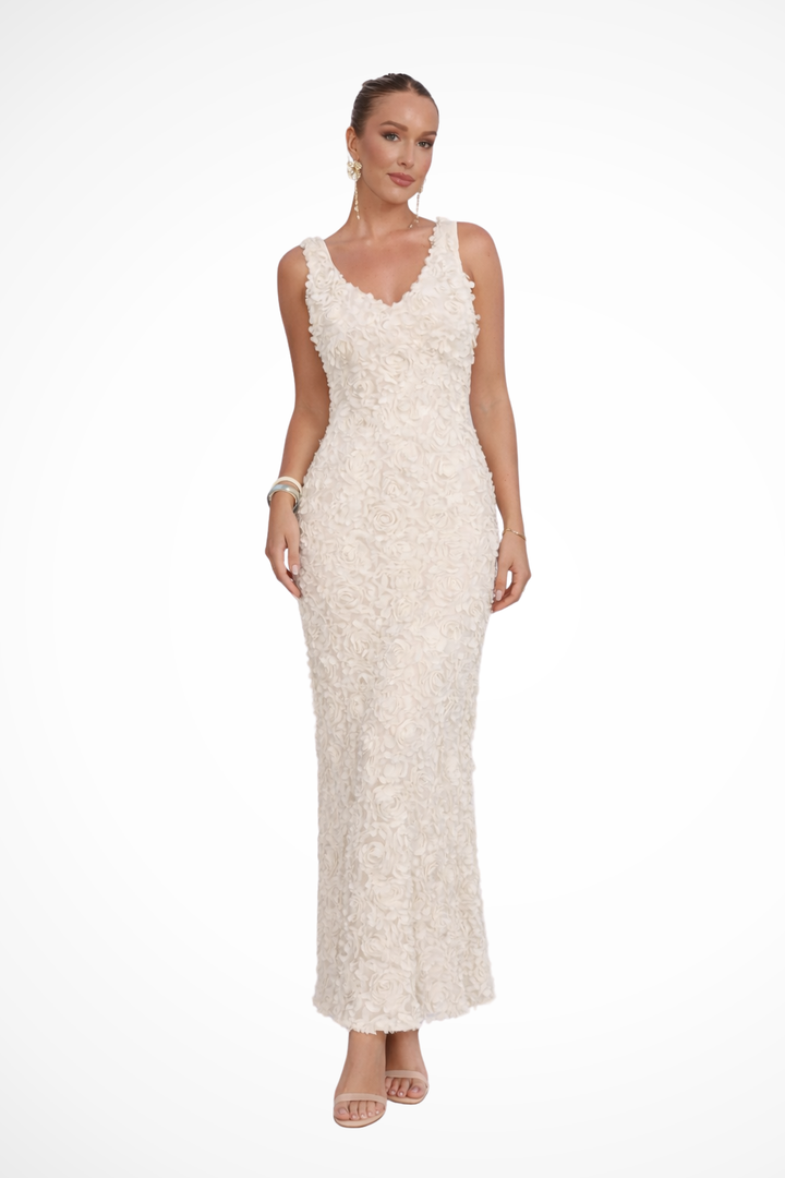 Stylish women's V-neck sleeveless wedding guest dress with delicate floral texture. A chic choice for events.