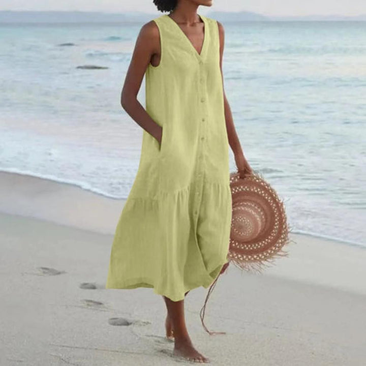 Chic sleeveless V-neck midi dress for women, ideal for a refined summer look or versatile party outfit.