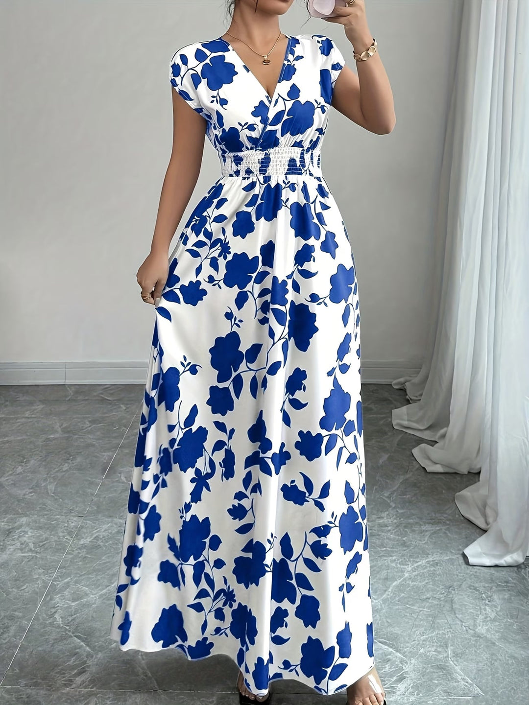 Elegant women's V-neck sleeveless summer dress. Ideal for versatile casual or dressy looks.