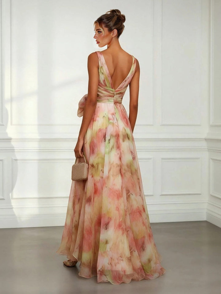 Sleeveless V-neck maxi dress for women, with a chic tie-waist & beautiful floral print, ideal for evening events.