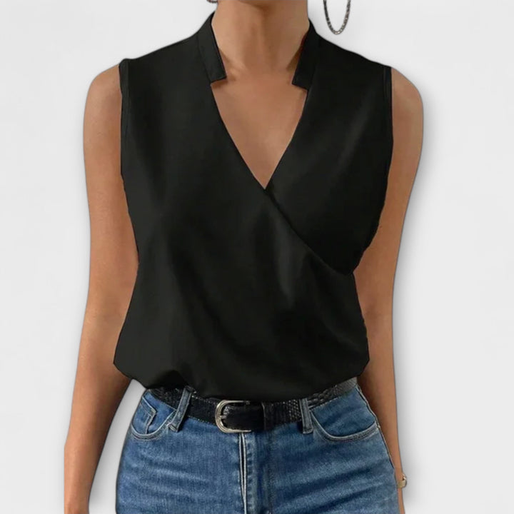 Women's elegant V-neck top with a subtle floral pattern, perfect for a fresh summer look.