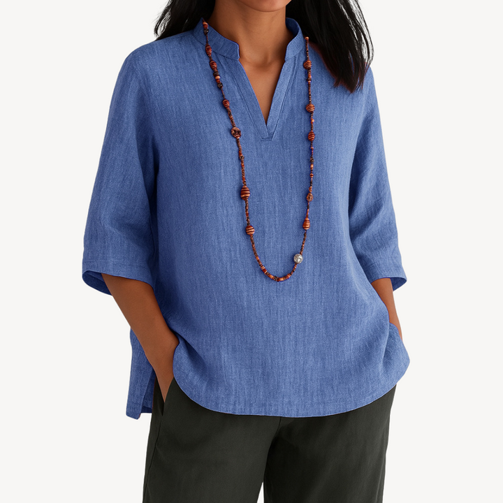Elegant women's V-neck tunic top in a relaxed fit, perfect for chic casual wear. Available in multiple colors.