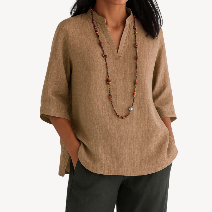 Chic women's V-neck blouse with 3/4 sleeves & relaxed fit, ideal for versatile everyday style in blue, brown, green, red.