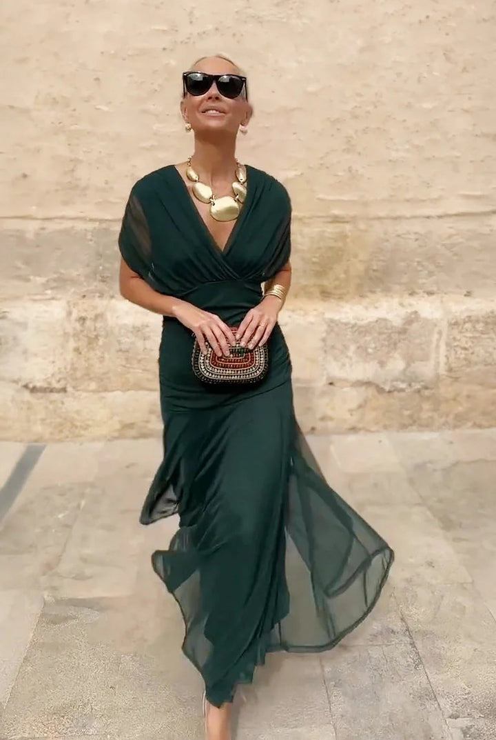 Formal V-neck wrap maxi dress for women, featuring elegant sheer sleeves. Ideal for evening events & special occasions.