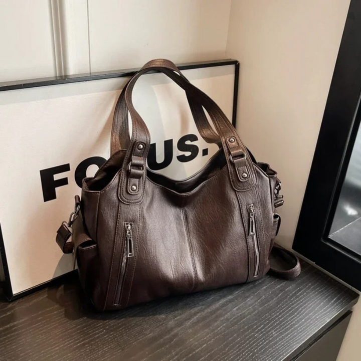 Chic vegan leather women's shoulder bag, converts to crossbody. Stylish handbag for travel & fashion accessory.