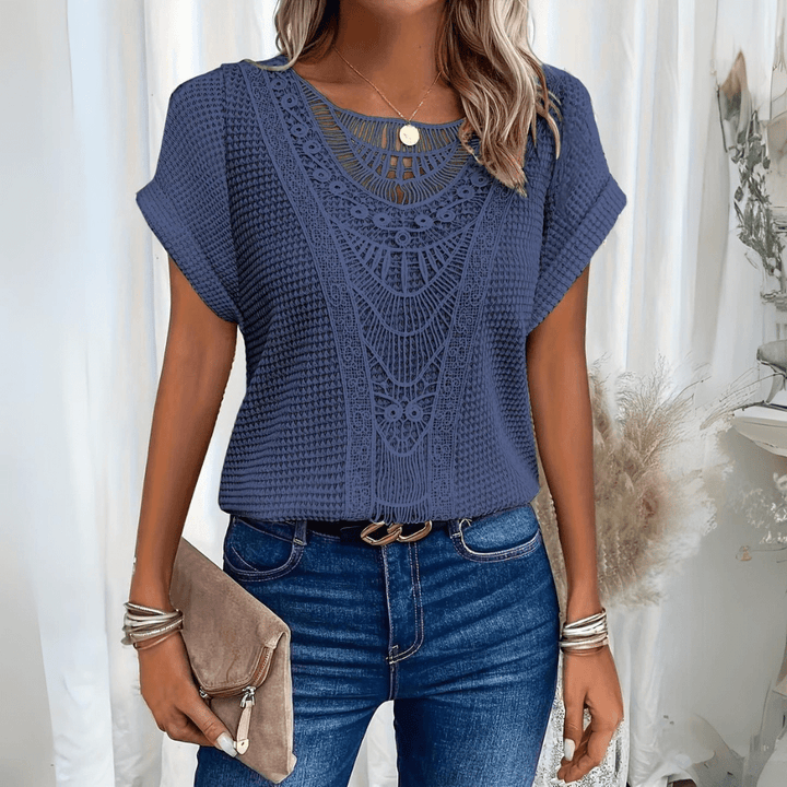 Full view of a classic women's elegant lace top, ideal for everyday chic or formal attire.