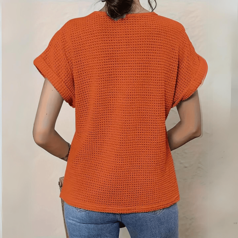 Comfortable women's lace top in classic style, perfect for a chic summer outfit.