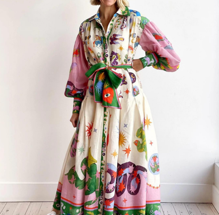 Elegant women's volume maxi dress with vibrant multicolor pattern, perfect for summer occasions. Flowy & comfortable.