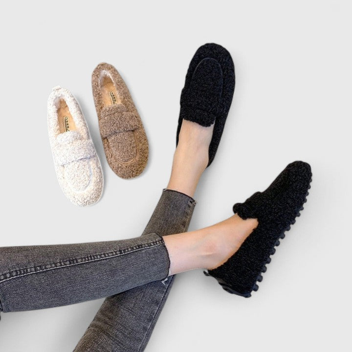 Elegant women's warm loafer slippers for cozy winter comfort, perfect as stylish house shoes with a non-slip sole.