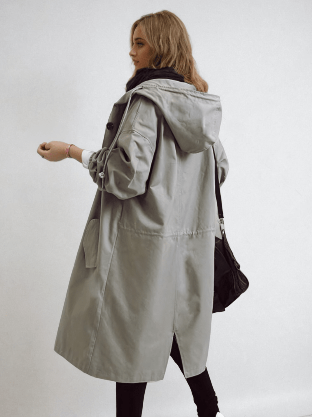 Stylish women's water-repellent trench coat, a classic all-season jacket for chic and comfortable outerwear.