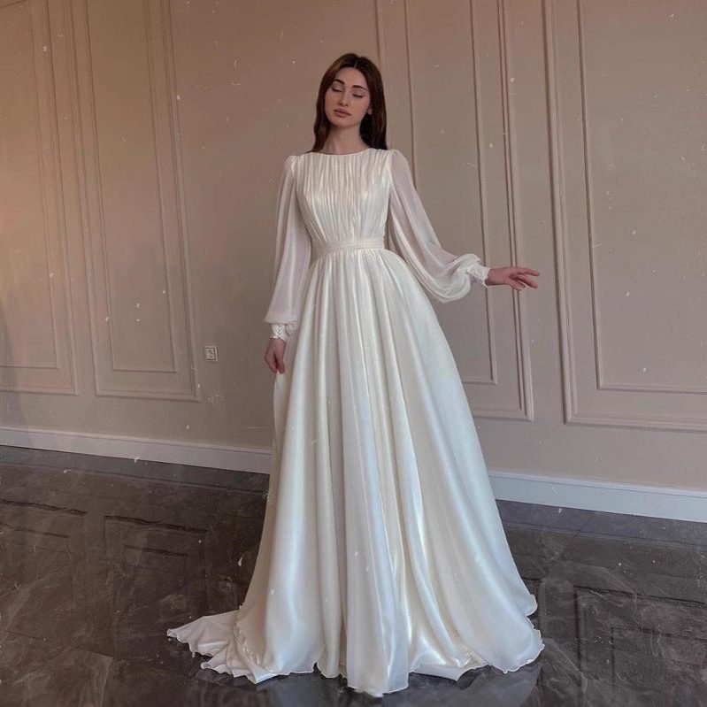 Graceful women's formal maxi dress with elegant long sleeves, suitable for sophisticated wedding guests.