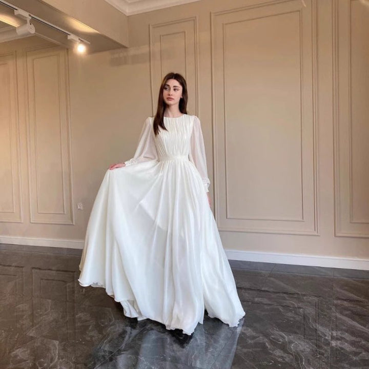 Modest long sleeve women's maxi dress, an elegant choice for wedding guests, formal events & special occasions.