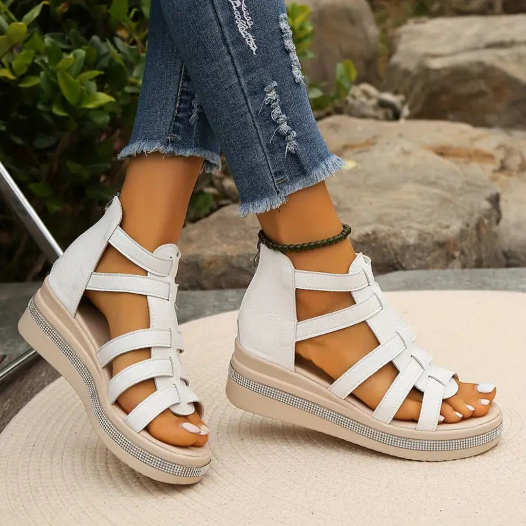 Chic women's elegant wedge sandals with dazzling rhinestone details, great for summer fashion.