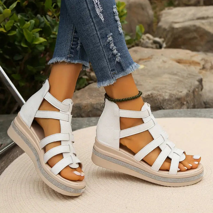 Chic women's elegant wedge sandals with dazzling rhinestone details, great for summer fashion.