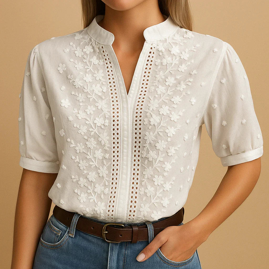 Versatile women's long-sleeve white blouse with a stand collar and delicate embroidery, ideal for office or casual outfits.