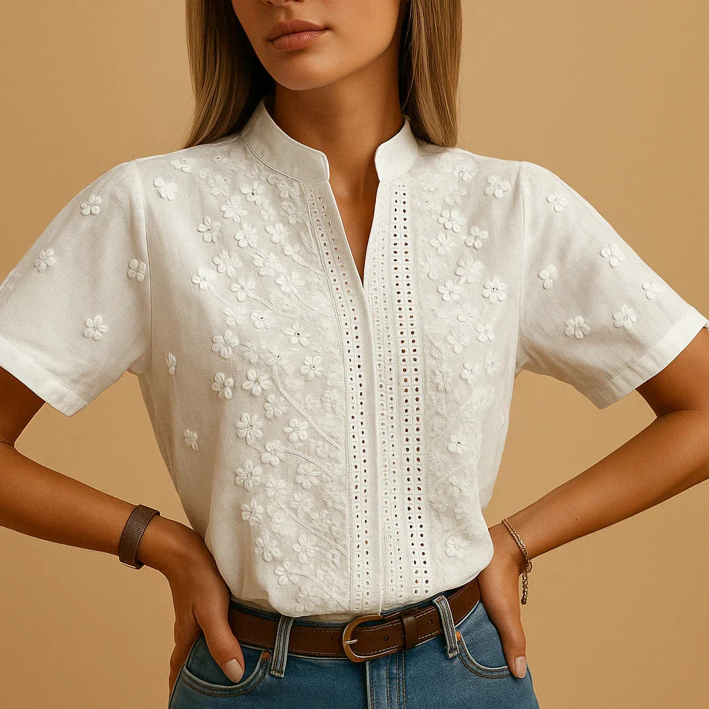 Chic women's white embroidered blouse featuring a sophisticated stand collar and long sleeves for elegant office wear.