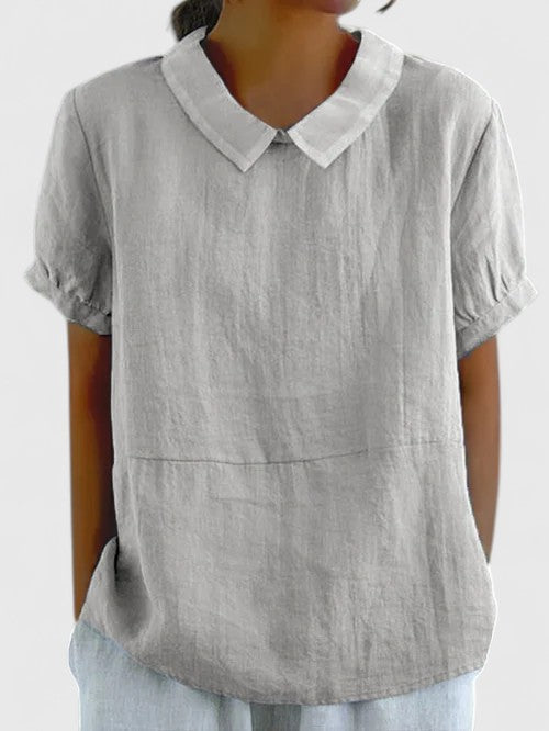 Elegant women's white button-down shirt, long sleeve, perfect for business casual and office wear.