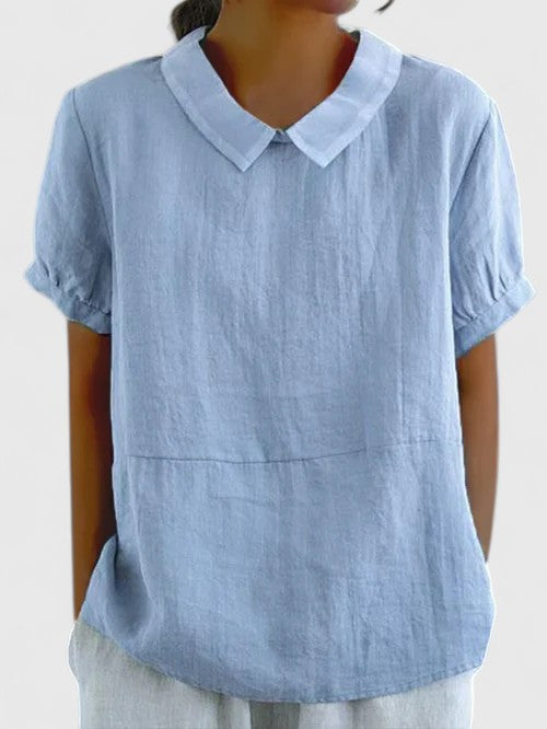 Refined women's elegant button-down shirt, ideal for professional office wear and sophisticated everyday style.