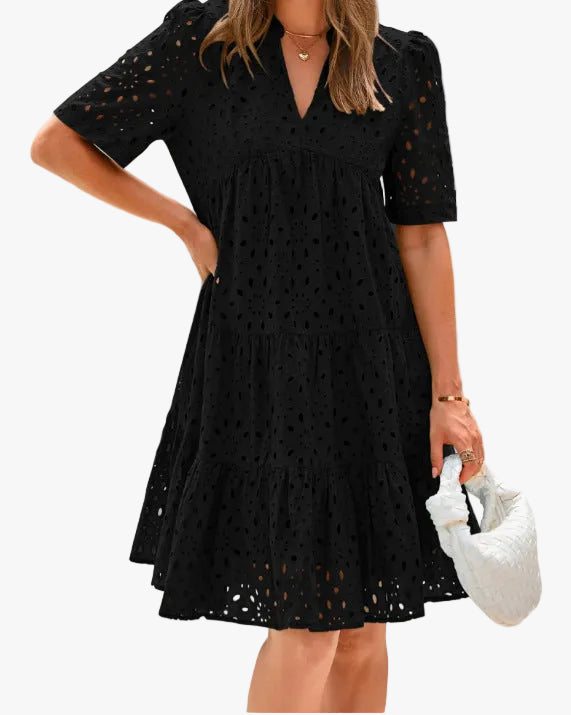 Elegant women's white eyelet midi dress with V-neckline & tiered skirt. Perfect for summer events.