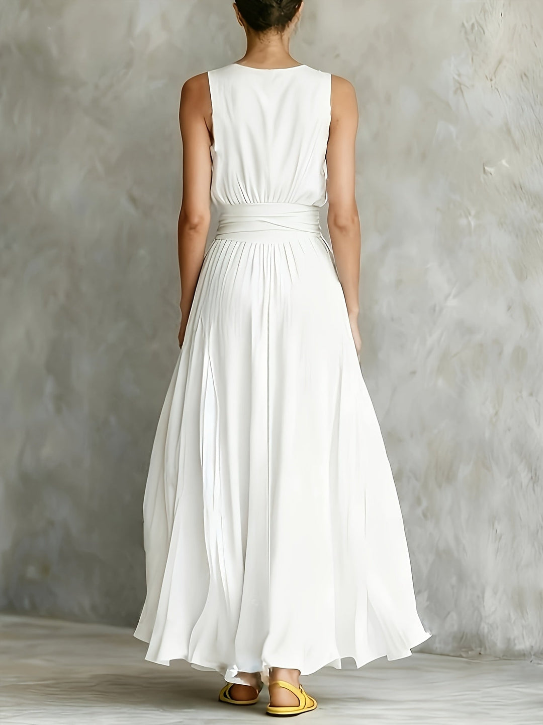 Stylish white women's sleeveless maxi dress, A-line cut, ideal for elegant summer events, casual wear, or vacation.