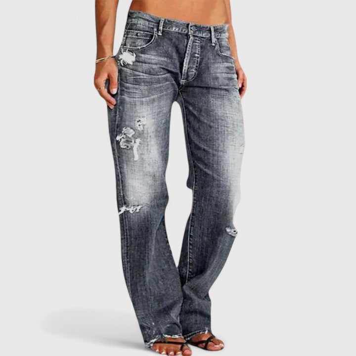 Model showcasing elegant women's wide-leg jeans with a relaxed fit for a chic, comfortable style.