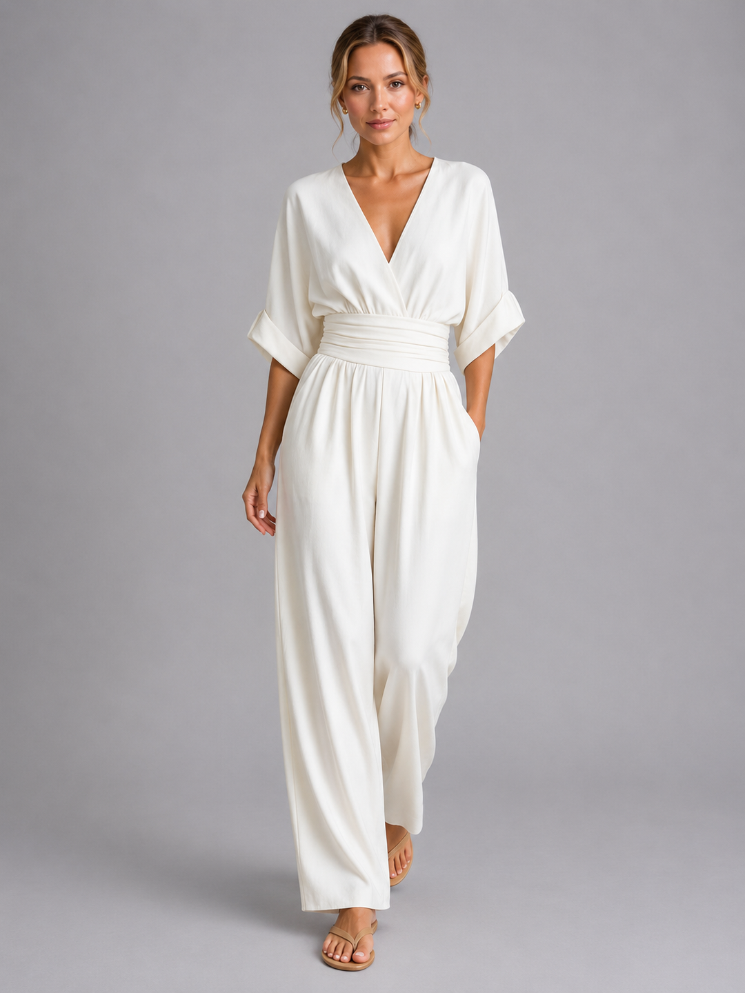 Elegant women's wide-leg jumpsuit with a cinched waist, perfect for summer fashion or chic casual wear.