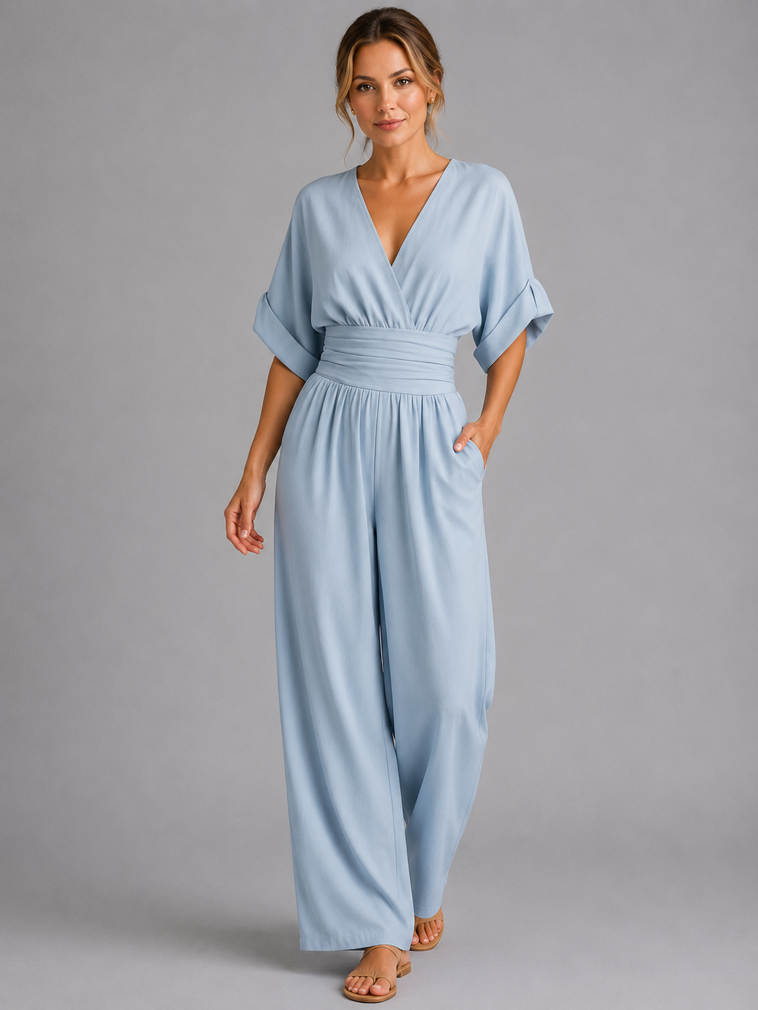 Comfortable women's wide-leg jumpsuit with elastic cinched waist, a versatile one-piece for relaxed summer style.