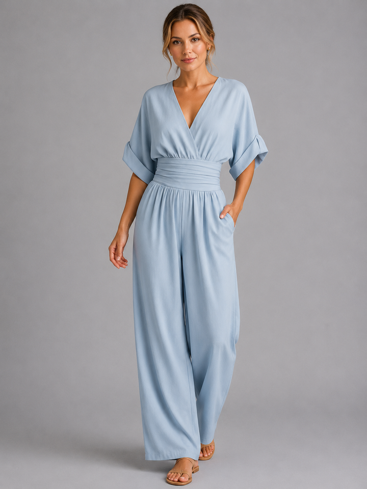 Comfortable women's wide-leg jumpsuit with elastic cinched waist, a versatile one-piece for relaxed summer style.