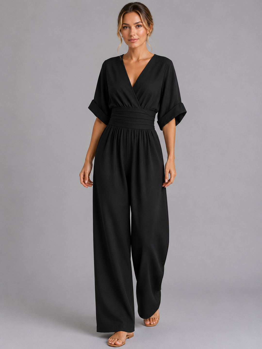 Flowy wide-leg women's jumpsuit with a comfortable cinched waist, capturing elegant movement for summer fashion.