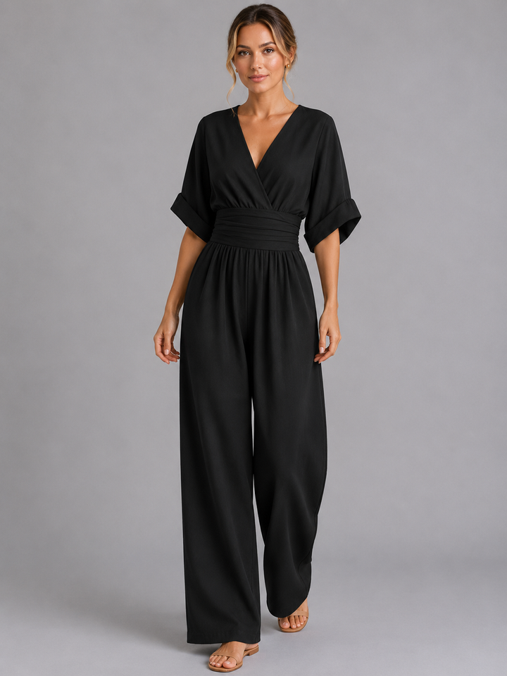 Flowy wide-leg women's jumpsuit with a comfortable cinched waist, capturing elegant movement for summer fashion.