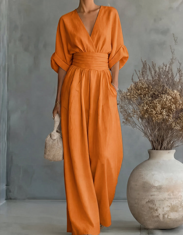 Relaxed yet elegant women's wide-leg jumpsuit with a flattering wrap bodice. Comfortable chic fashion.