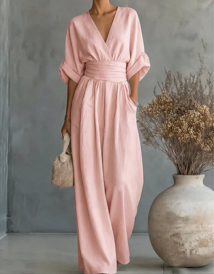 Make a statement in this elegant women's wide-leg jumpsuit with a flattering wrap bodice. Chic fashion.