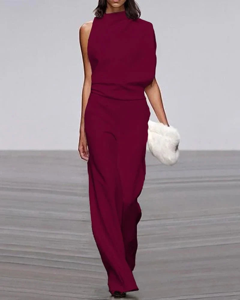 Fashionable women's wide leg jumpsuit, an elegant wedding guest outfit with a contemporary sleeveless look.