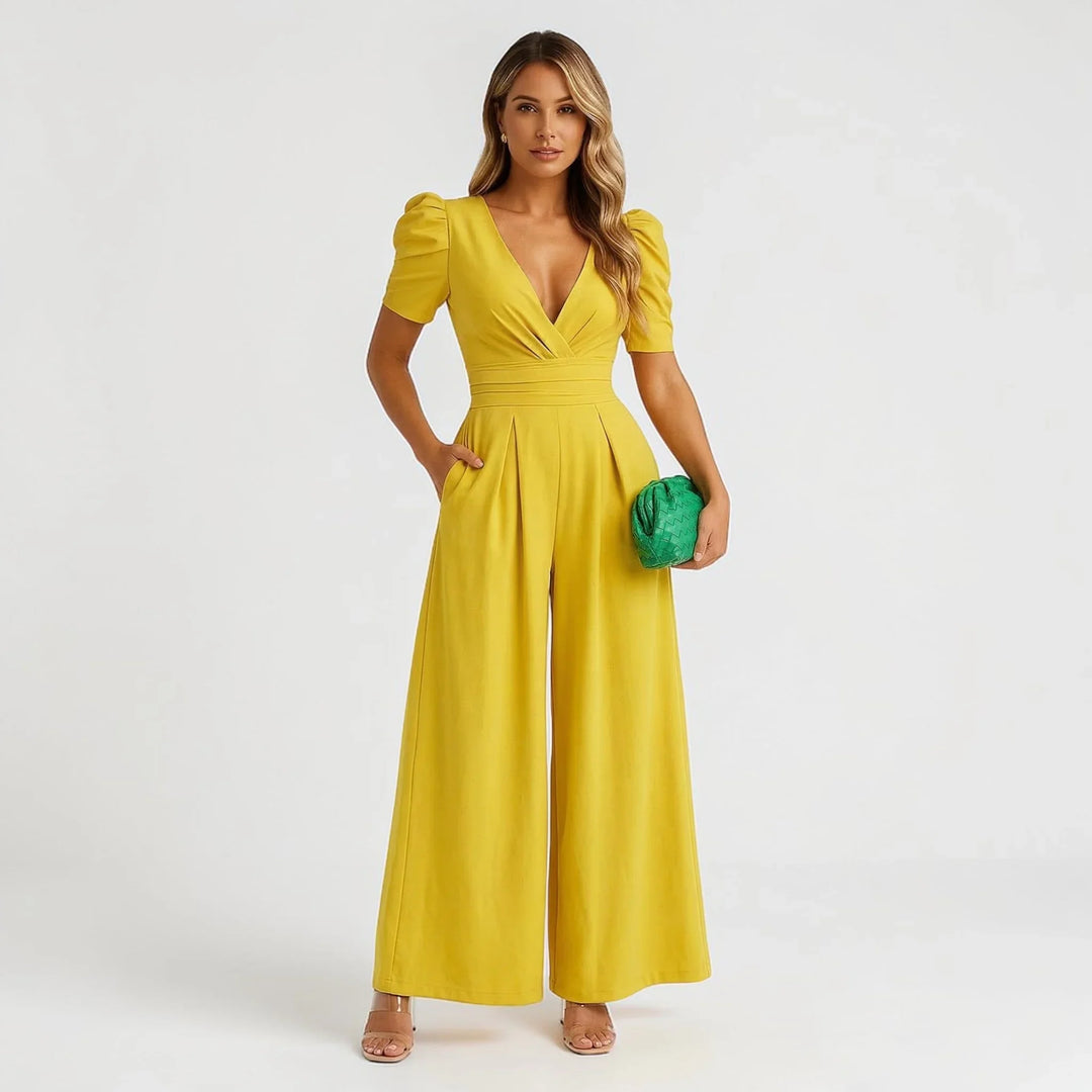 Chic women's tailored jumpsuit, wide-leg design with elegant puff sleeves, perfect wedding guest attire.