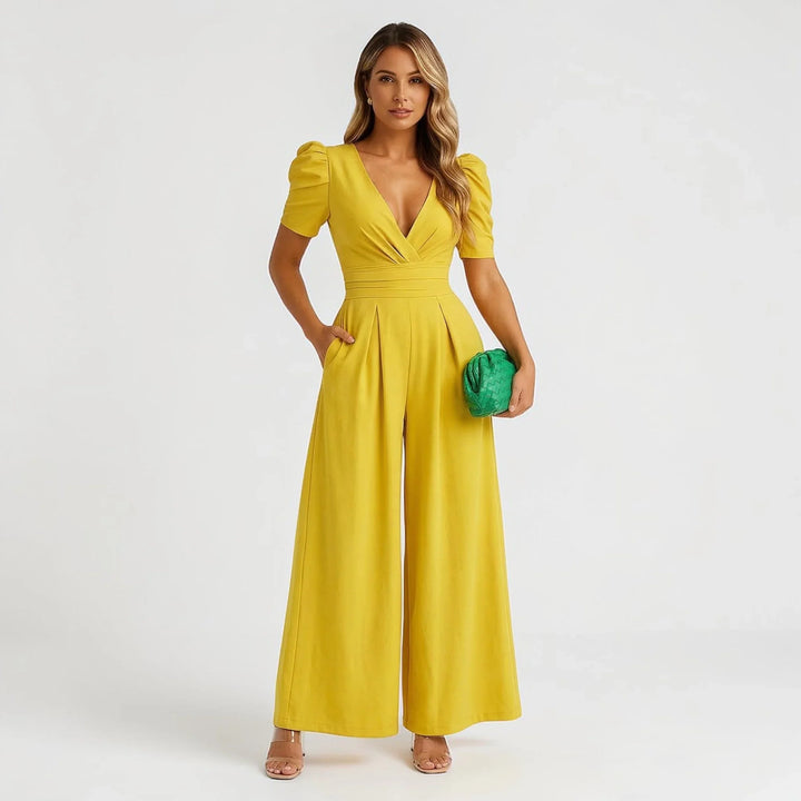 Chic women's tailored jumpsuit, wide-leg design with elegant puff sleeves, perfect wedding guest attire.