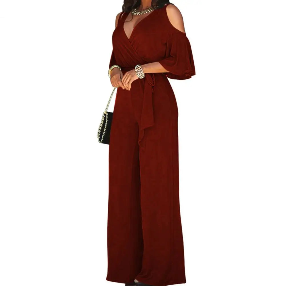 Chic women's wide leg jumpsuit featuring a flattering wrap front; perfect for elegant formal or casual events.
