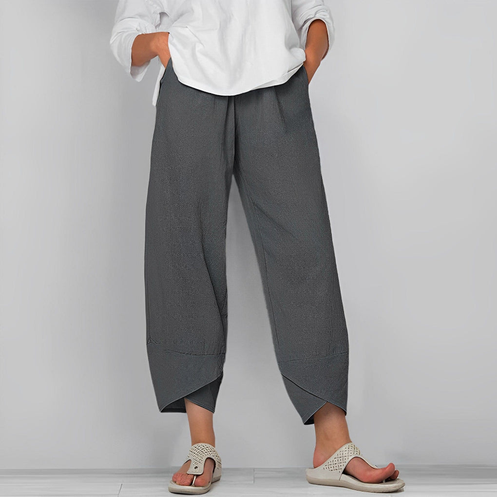 High-rise women's wide-leg satin trousers in a luxurious, flowy design. Elegant and comfortable evening wear pants.