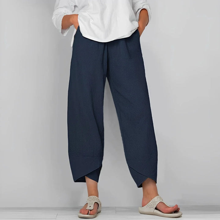 Chic women's wide-leg satin trousers offering a flowy, elegant silhouette. Comfortable high-rise luxury evening pants.