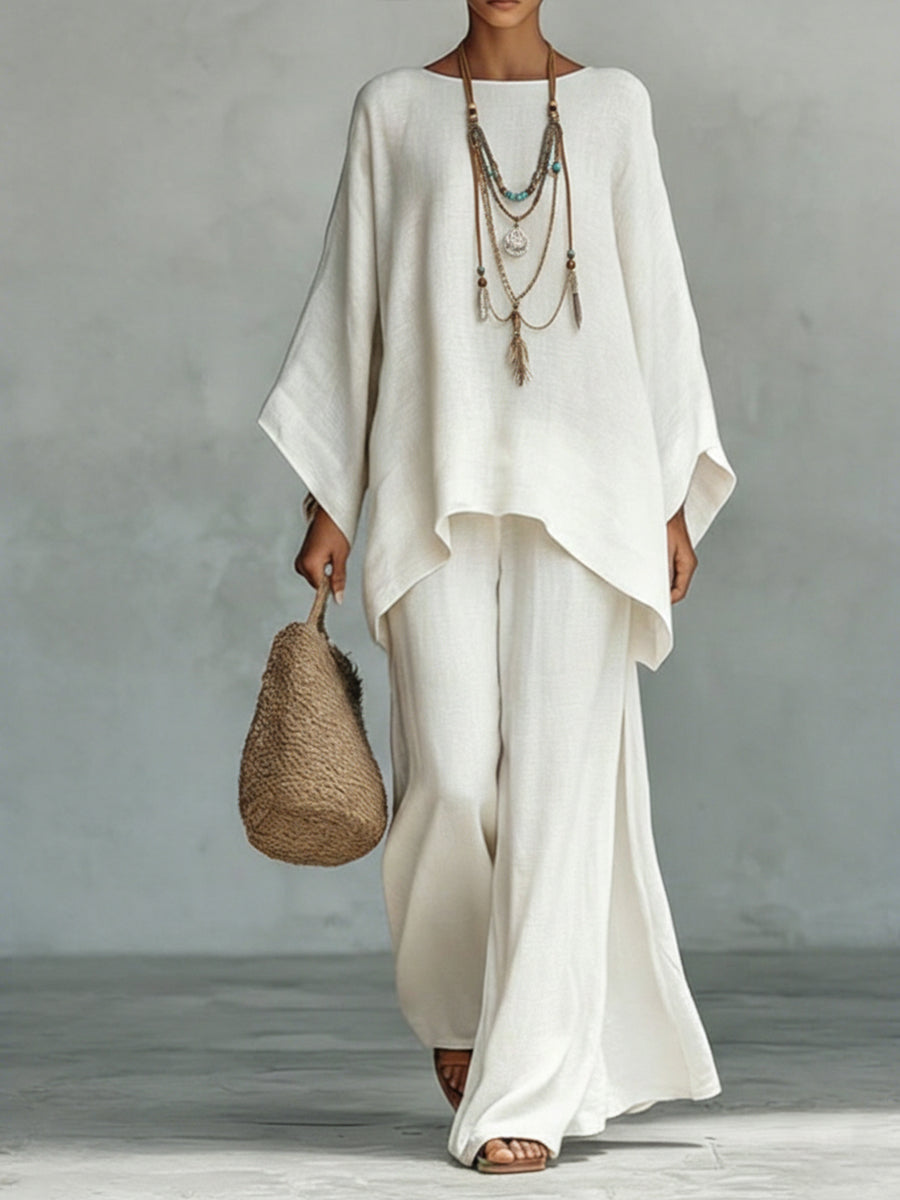 Elegant women's wide sleeve top & wide leg trouser linen set. Comfortable two-piece summer casual outfit.
