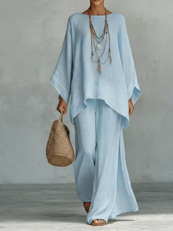 Women's two-piece linen set with a wide sleeve top & wide leg trousers. Stylish, comfortable casual wear.