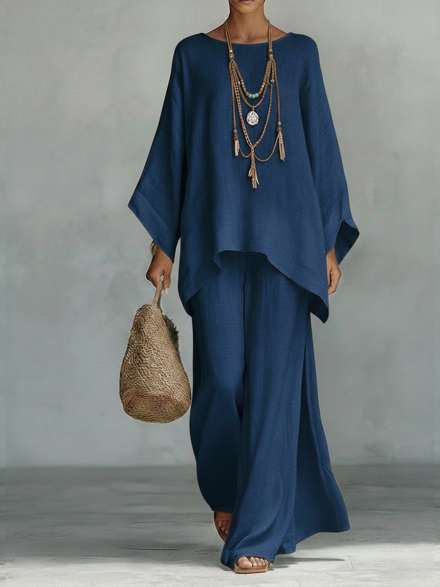 Sophisticated women's wide sleeve top & wide leg trouser set. Elegant linen two-piece for casual comfort.
