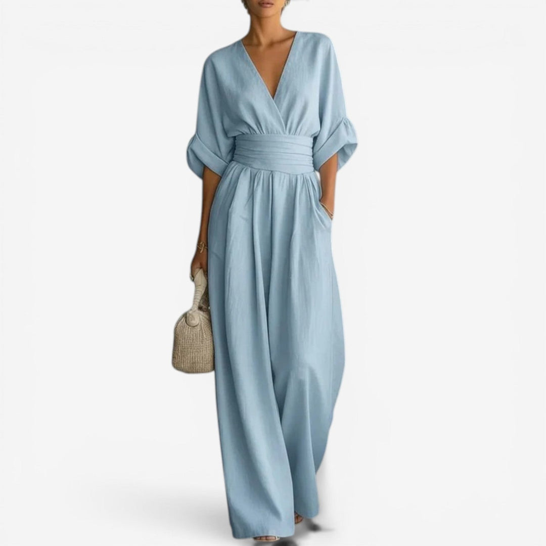 Elegant women's wide sleeve V-neck jumpsuit. Chic one-piece for versatile casual & occasion fashion.