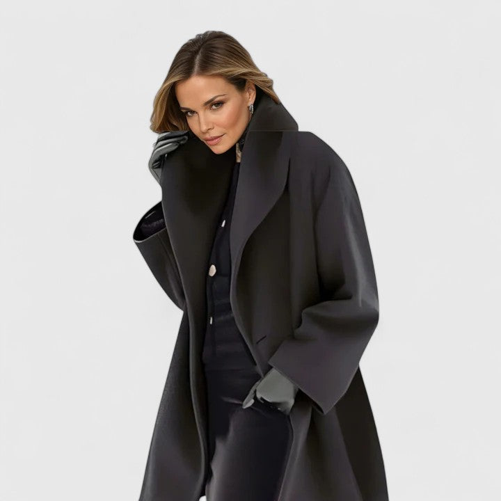 Model wearing a long, elegant women's winter coat. Relaxed fit and stylish layering for autumn & everyday wear.