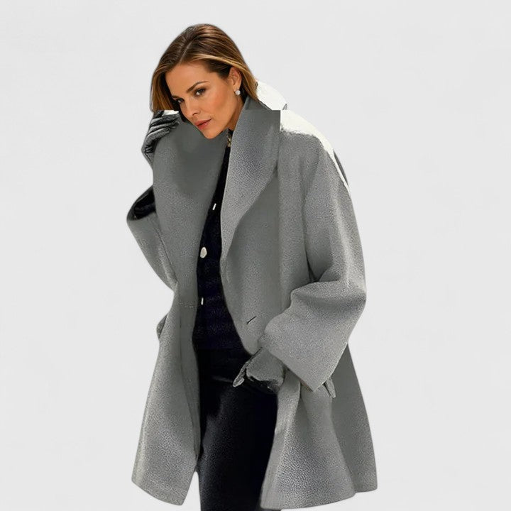 Minimalist elegant women's winter coat, warm outerwear for chic fall and winter cold weather fashion.