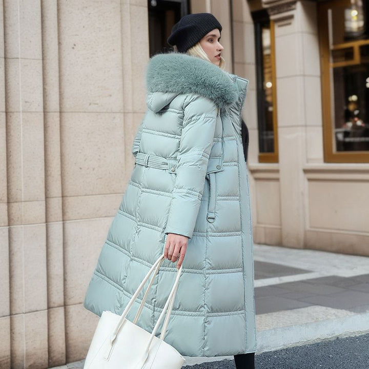 Practical yet chic women's winter coat, offering warmth, a tailored fit, and a versatile removable hood.